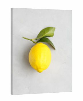large ripe yellow lemon with leaves. traditional italian fruit Sicilian lemon on a light background top view.