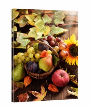 wicker basket full of autumn fruits