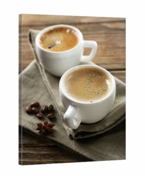 Two cups of coffee on wooden table