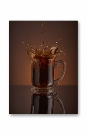 Ice cappuccino splash, refreshing mug of coffee on brown background.