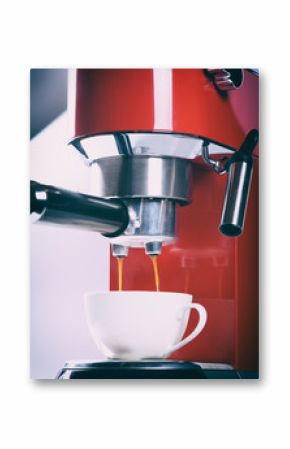 red espresso coffee machine is making a coffee