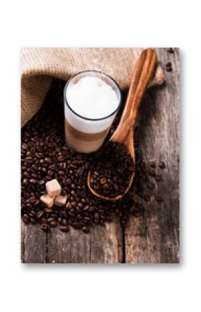Coffee on a wooden table. Dark background.