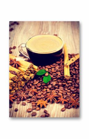 Cup of coffee on wooden background. Toned image