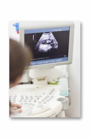 The doctor looked at the ultrasound screen with baby pictures.