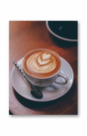 close up a coffee cup on wooden table.