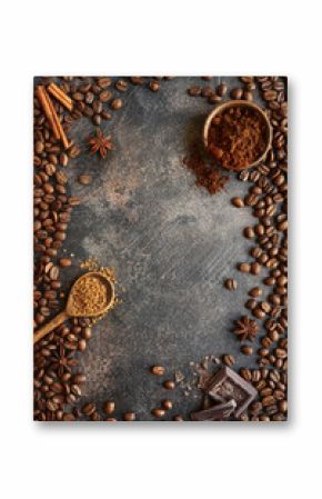 Ground coffee and coffee beans with spices .Top view with copy space.