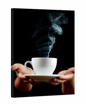 Cup of coffee in the women's hand on black background