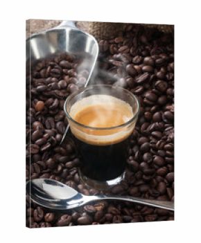 Espresso coffee in glass cup with coffee beans.