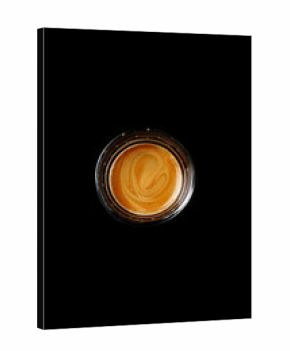 Glass of espresso on a black background