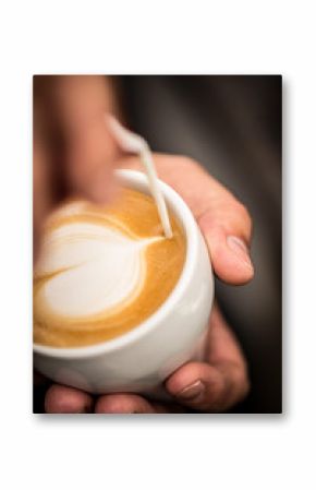 Coffee with heart shape latte art serve in white cup