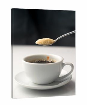 pouring brown sugar in white cup