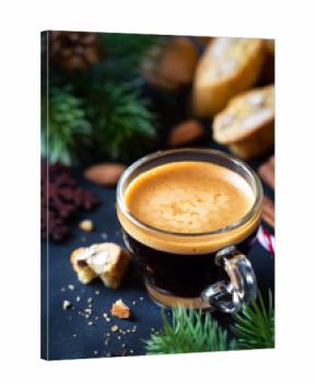 Christmas morning concept with espresso coffee, almond cantuccini biscuits and festive decorations