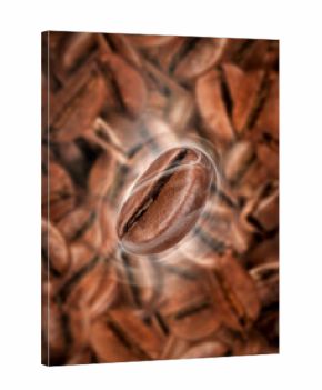 Coffee bean with hot steam close-up on a background of lots of coffee beans