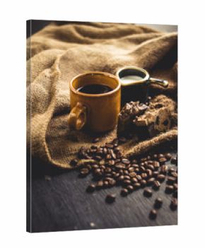 Black coffee Arabica In brown glass And milk and dessert Sack background in low light area