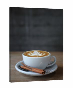 cappuccino or Latte art coffee made from milk on the wood table in coffee shop.