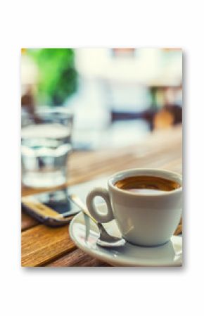 Coffee. Cup of coffee mobile phone on table on restaurant coffee house terrace. Coffee break business