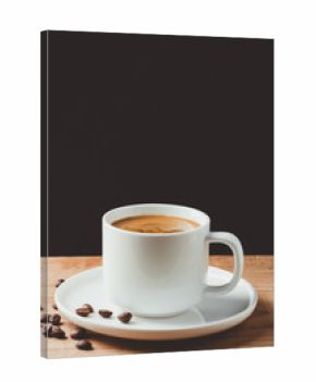 Espresso coffee cup on wooden table and dark background