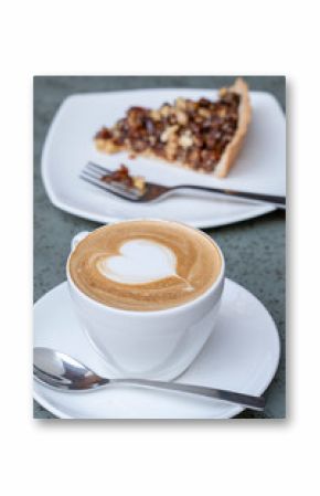 Cup of latte coffee with cake, closeup