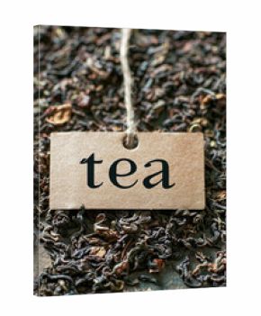 tea on a wooden table as a background and the inscription tea. drink