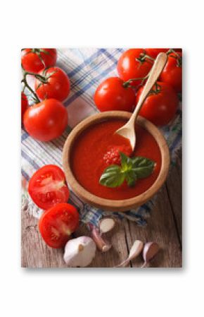 tomato sauce with garlic and basil in a wooden bowl. vertical  