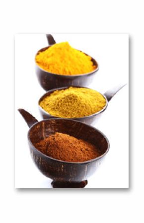 spices - pile of bright Madras Curry Powder and 2 bowls behind