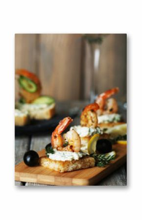 Appetizer canape with shrimp and olives