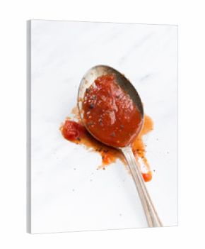 tomato sauce in the spoon, vertical