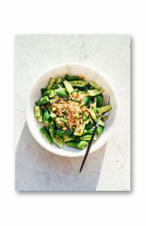 smashed cucumber salad in marble bowl