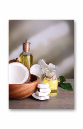 Coconuts and coconut oil on wooden table