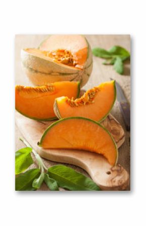 cantaloupe melon sliced on wooden background