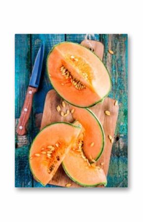 sliced ripe melon on a cutting board