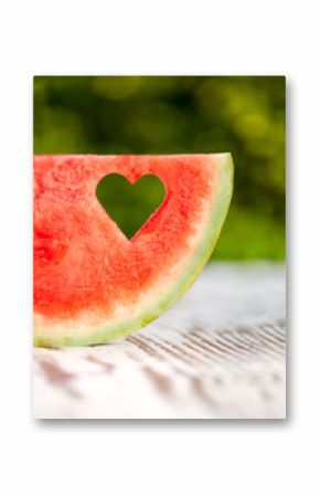 slice watermelon with a hole in the shape of heart