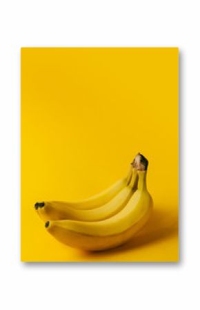 Ripe bananas on the yellow background