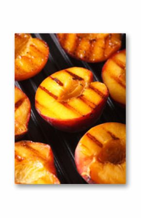 Fresh peaches on grill macro. Vertical  
