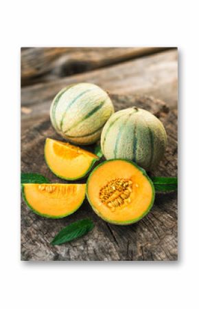 Fresh melons on wooden table