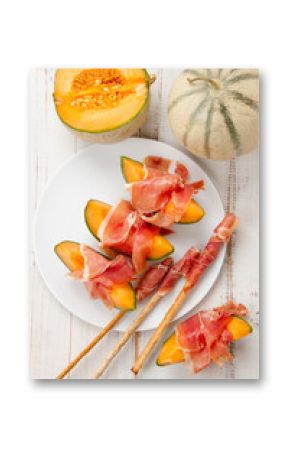 Melon with prosciutto and grissini
