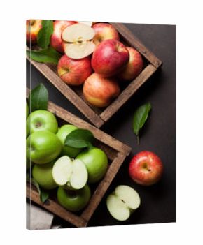 Green and red apples in wooden box