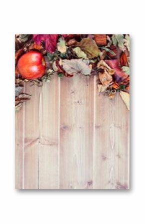 Overhead view of apple and leaves on table