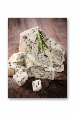 Blue cheese on wooden background