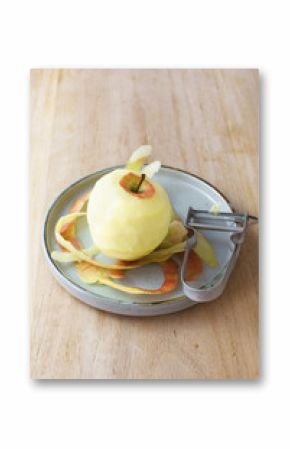 Peeled apple and speed peeler