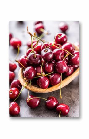 Cherries. Sweet Cherries. Fresh Cherries. Ripe cherries on wooden concrete table - board.