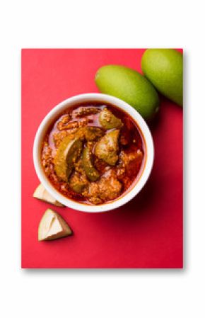 Homemade Mango Pickle or aam ka achar or achaar in white bowl, selective focus