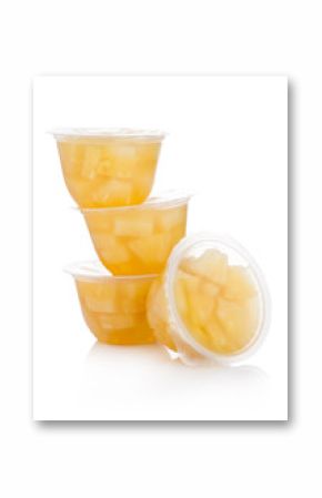 Single cups with pineapples in fruit jelly