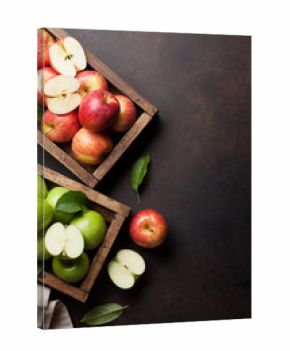 Green and red apples in wooden box
