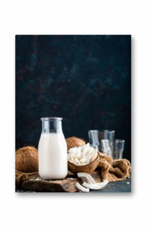 Fresh coconut milk in glass bottle, vegan non dairy healthy drink