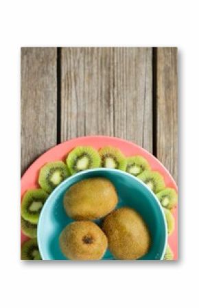 Kiwi fruits arranged on wooden table