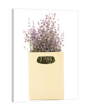 Bouquet of lavender flowers in a cardboard organic bag isolated on a white background.