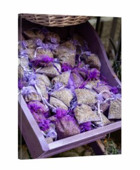 Small violet bags with aromatic seeds of lavender plant on market in Provence
