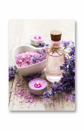 Heart-shaped bowl with sea salt, oil  and fresh lavender flowers
