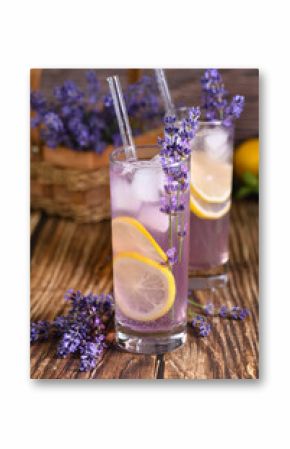  A glass of homemade lavender lemonade. Garnished with lemon wedges and lavender sprigs